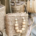 Woven Rattan/Straw Crossbody Bag with Wooden Bead Embellishment & Gold Chain Strap